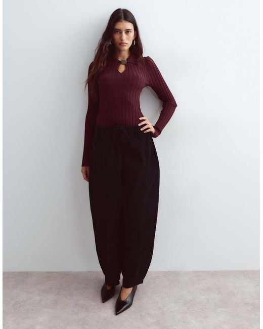 ARRANGE Red Knitted Ribbed Bodysuit With Oversized Button