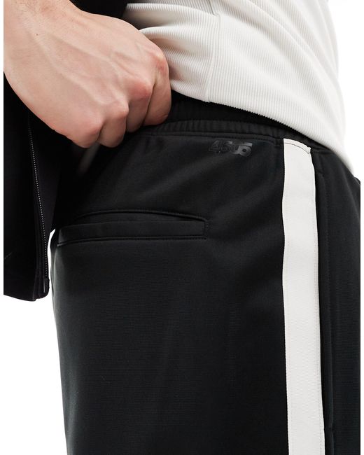 Pantalones cortos deportivos s con raya lateral blanca en contraste ASOS 4505 de hombre de color Black