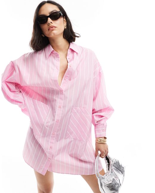 Vestido camisero en tono pastel a rayas extragrande con bolsillos bajos ASOS de color Pink