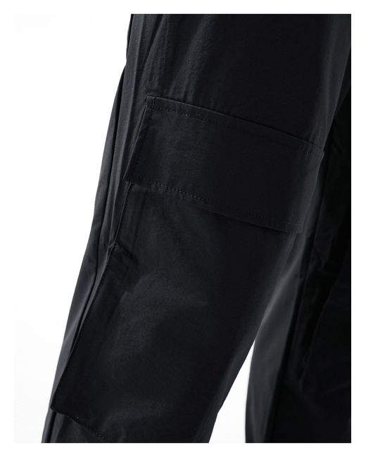 Pantaloni cargo slim neri di ADPT in Black da Uomo