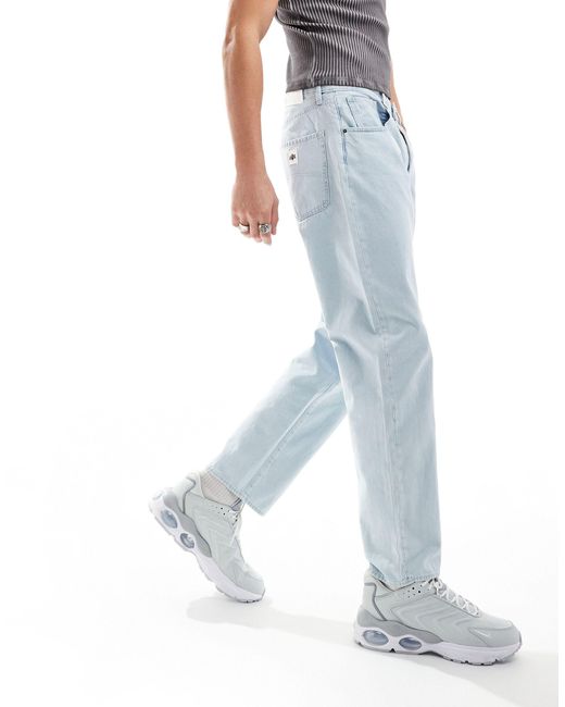 Armani Exchange – weite, schmal zulaufende jeans mit heller waschung in Blue für Herren