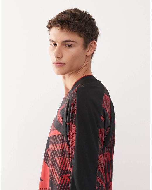 Umbro – bedrucktes, langärmliges trikot-oberteil in Red für Herren