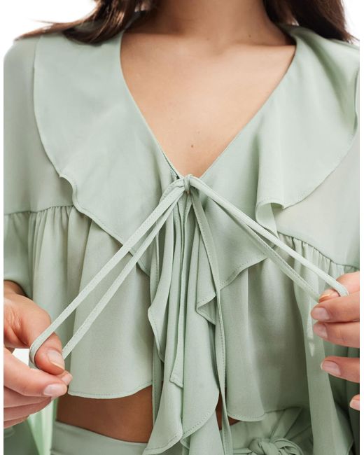 TFNC London Green Tie Front Cape Top With Ruffle Detail