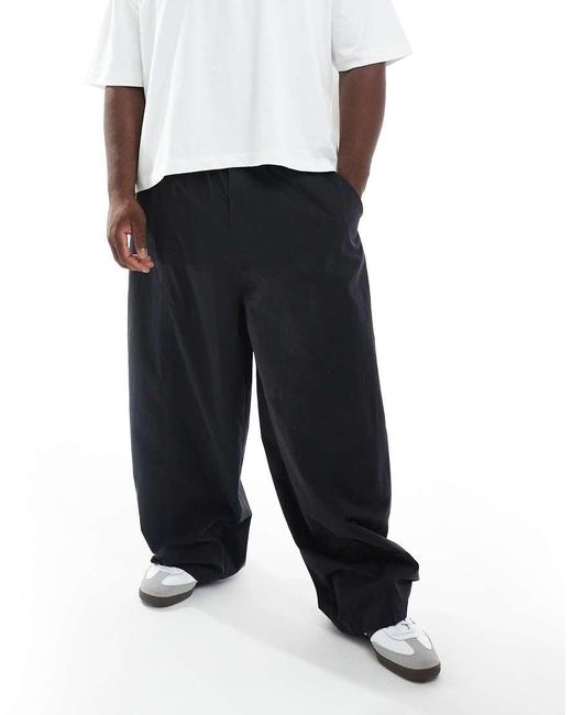 Pantalones Negros Holgados Extragrandes De ASOS de hombre de color Black