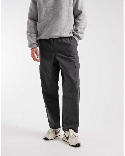 Pantalones Negros Cargo De Corte Tapered Holgado Sin Cierres De Tejido Antidesgarros De ASOS de hombre de color Gray