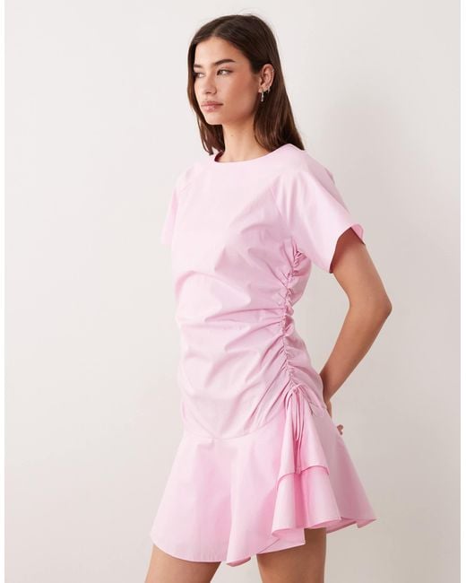 asos pink mini dress ASOS DESIGN mini dress with soft ruffled hem in light pink