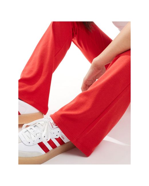 Pantalon évasé à taille haute Bershka en coloris Red