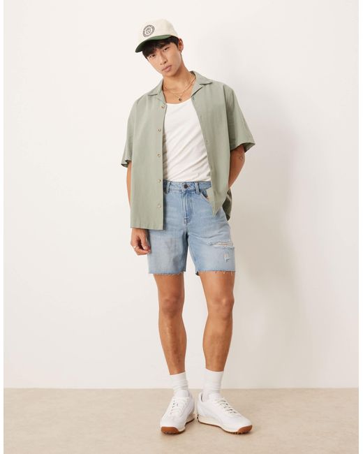 Short en jean mi-long coupe slim à déchirures - clair délavé ASOS pour homme en coloris Blue