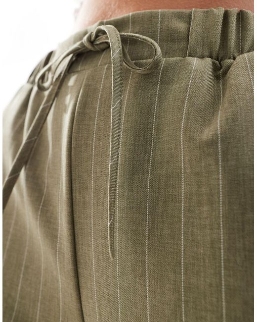 Asos design petite - pantaloni sartoriali verde oliva a righe di ASOS in Multicolor