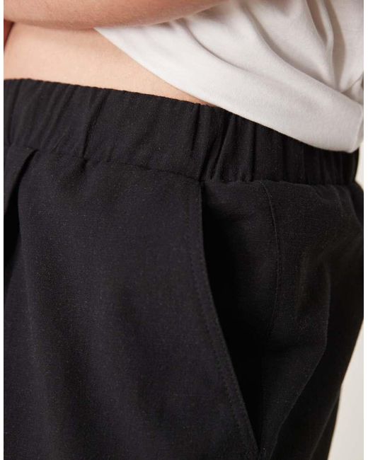 Pantalones Negros De Corte Tapered Extragrande Con Cinturilla Elástica De Mezcla De Algodón Y Lino De ASOS de hombre de color White