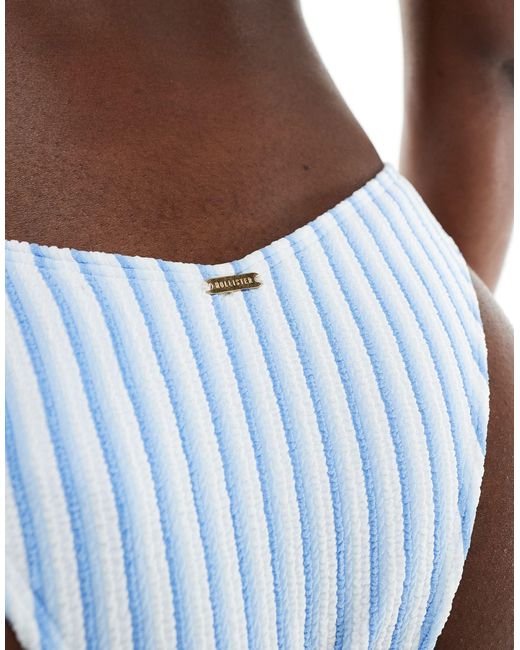 Slip bikini sgambati blu a righe a coste di Hollister in Brown