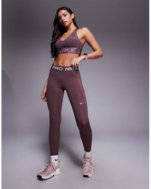 Nike di Nike in Purple