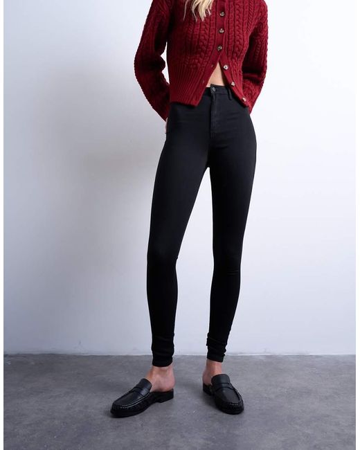 Vaqueros Negros De Corte Superpitillo Y Talle Alto Joni De TOPSHOP de color Black
