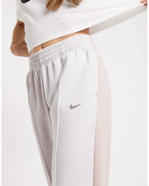 Nike Metallic Swoosh Colour Block joggers | Lyst UK