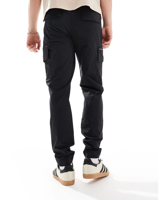 River Island – eng geschnittene cargohose in Blue für Herren