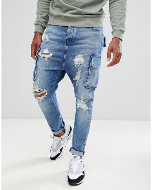 ASOS Denim – Jeans mit tiefem Schritt, Rissen und Cargo-Taschen in Blau für  Herren | Lyst AT