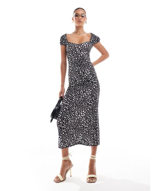 Robe texturée mi-longue nouée dans le dos avec coutures sous poitrine - imprimé noir et blanc ASOS en coloris Multicolor