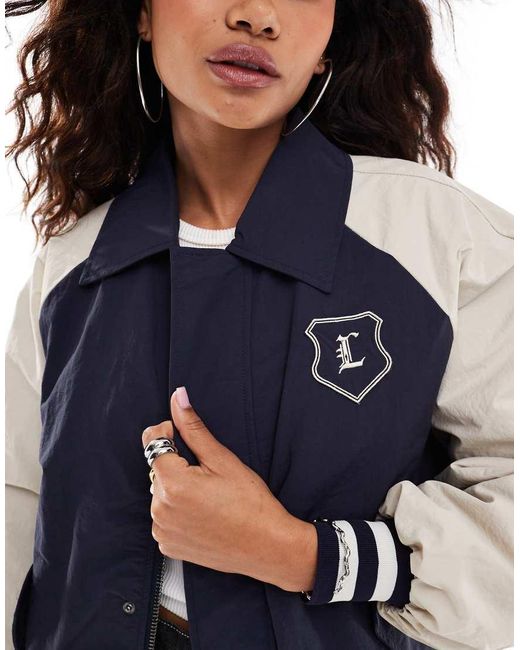 Chaqueta Bomber Con Mangas En Contraste Y Detalle De Solapas De Estilo Universitario De Lioness de color Blue