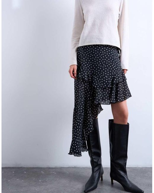 Falda Midi Negra Con Estampado De Lunares Blancos, Bajo Asimétrico Y Detalle De Volante De -Negro TOPSHOP de color White