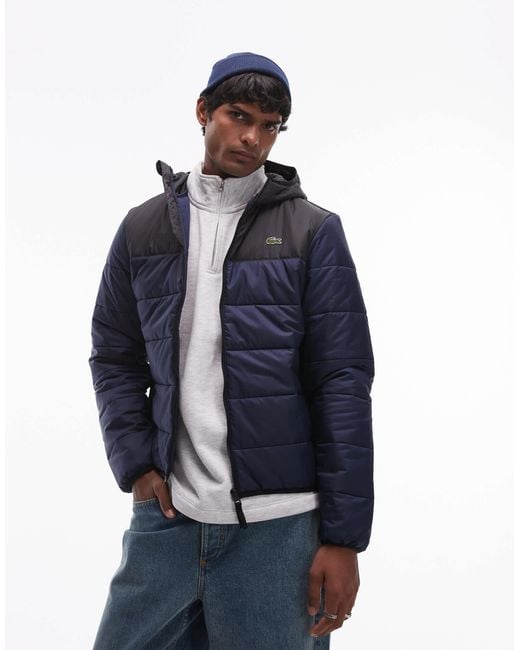 Lacoste – essentials – gesteppte puffer-jacke mit em blockfarben-design in Blue für Herren