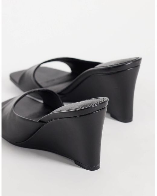 Raid Black Juniper mules mit keilabsatz