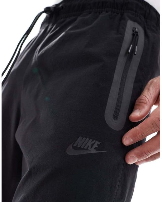 Nike Blue Tech Woven Open Hem Trousers for men
