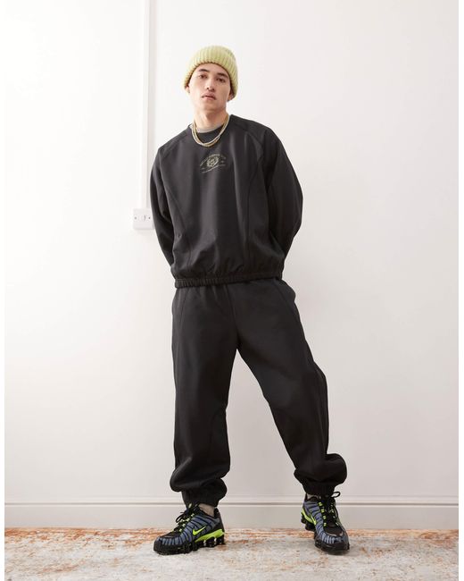 Weekday Black Co-ord Oversized joggers With Fantazy Fussball Graphic Print And Contrast Seams for men