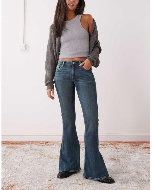 Monki Blue Katsumi Low Waist Flare Jeans With Bow Embellishment