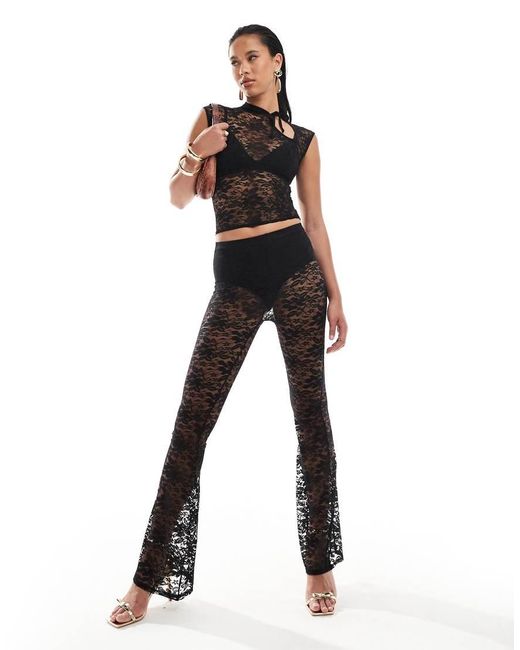 Pantalones De Campana Negros De Encaje Transparente De (Parte De Un Conjunto) Kaiia de color Black