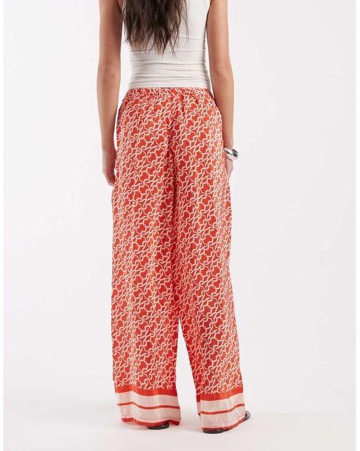 River Island Red Monogrammed Print Trousers