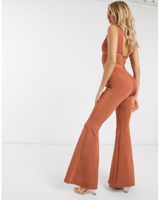 orange bandage plunge flared leg jumpsuit