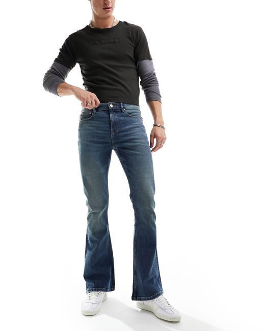 Jeans a zampa color lavaggio tinto di ASOS in Blue da Uomo