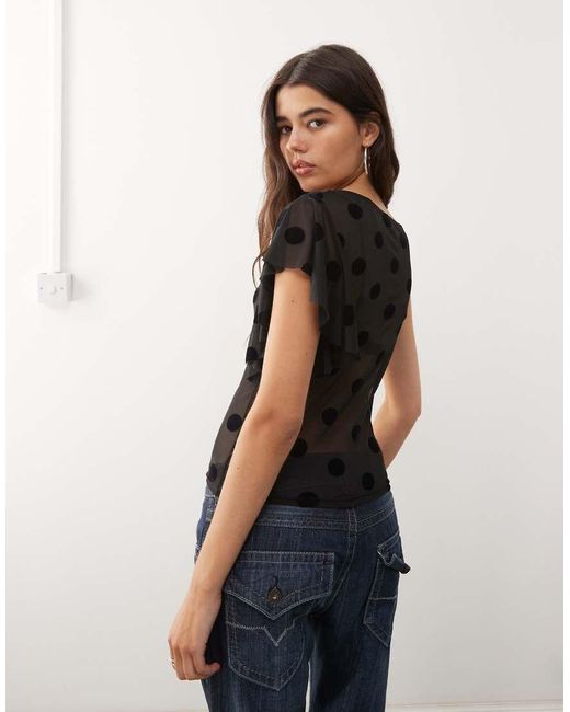 Top Asimétrico Con Estampado De Lunares De Malla De Collusion de color Black