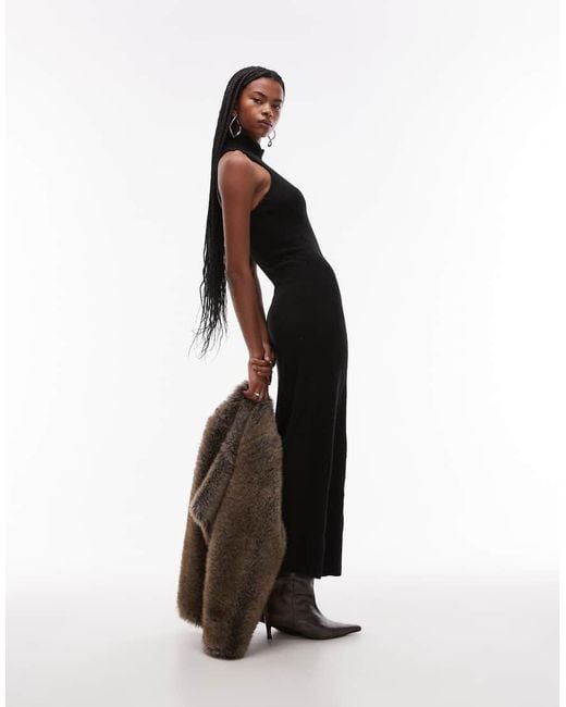 Mango Gebreid Maxi Jurk Met Open Achterkant En Hoge Hals in het White