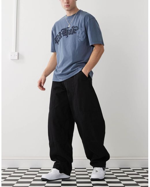 Pantalon bouffant effet raccordé à surpiqûres - délavé Collusion pour homme en coloris White