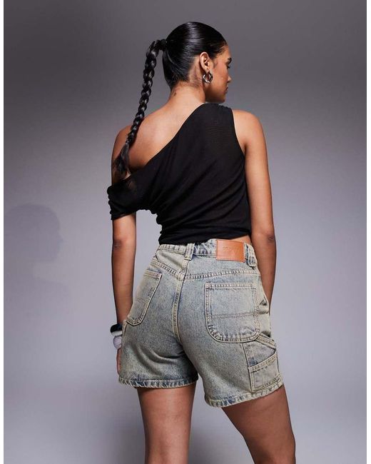 Pantalones Cortos Vaqueros De Estilo Carpintero Y Corte Alargado Con Lavado Envejecido De -Gris Princess Polly de color Gray