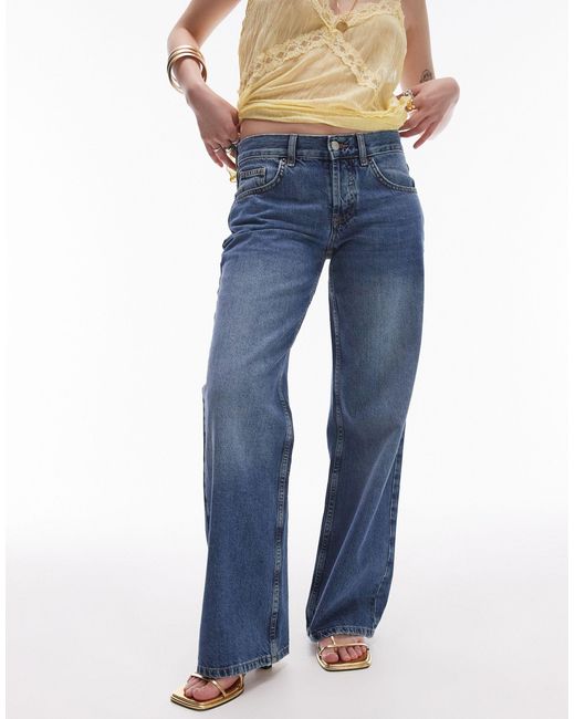 Ember - jeans a fondo ampio e vita bassa medio di Topshop Unique in Blue