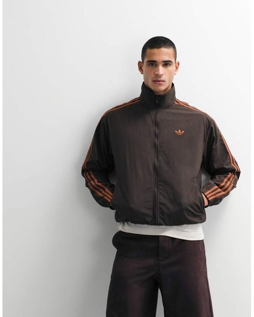 Adidas Originals Black Firebird Woven Track Top for men