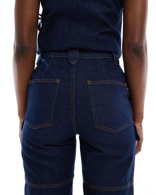 Jean fuselé style utilitaire - bleu délavé ASOS en coloris Blue