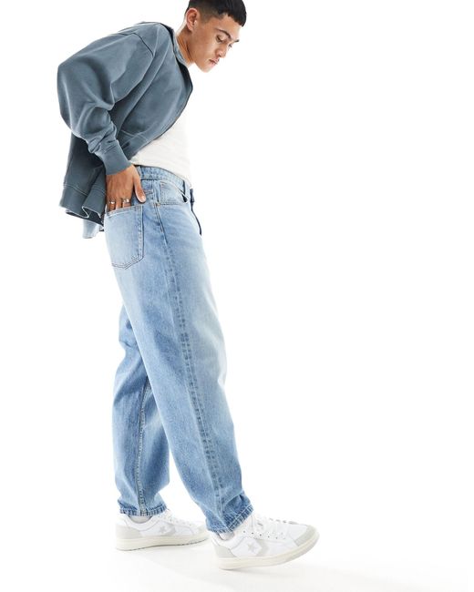 Jeans oversize affusolati lavaggio medio di ASOS in Blue da Uomo