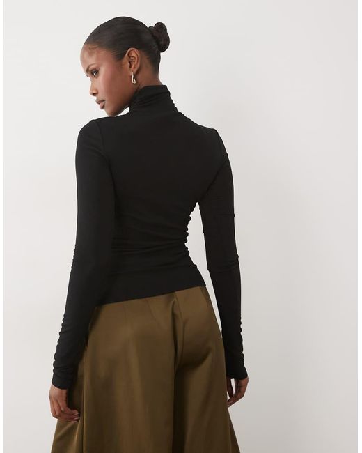 Noughts & Kisses Black Sheer High Neck Top
