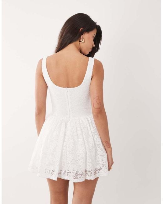 Aria Cove White Lace Scoop Neck Corset Detail Frill Hem Mini Dress