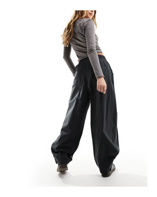 Pantalon baggy à enfiler avec détail plissé aux ourlets - gris délavé ASOS en coloris Black