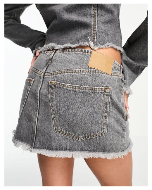 Ontario - minigonna di jeans a vita bassa lavaggio eleven con zip di Weekday in White