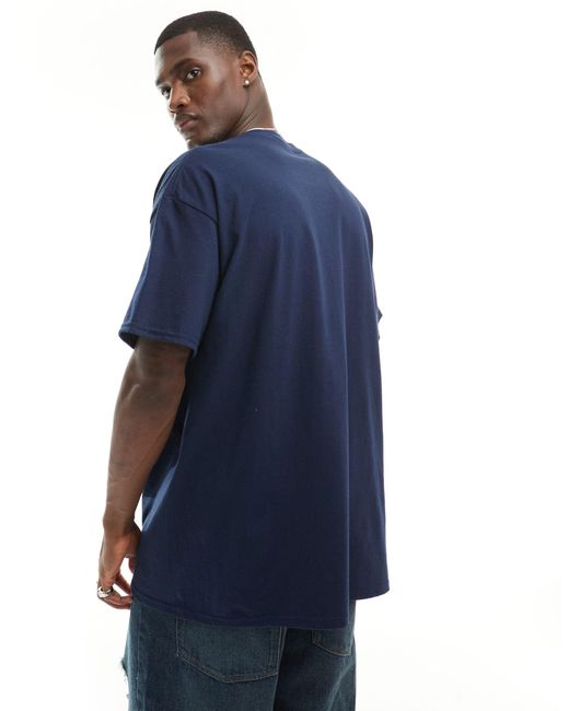 Camiseta extragrande con estampado en el pecho ASOS de hombre de color Blue