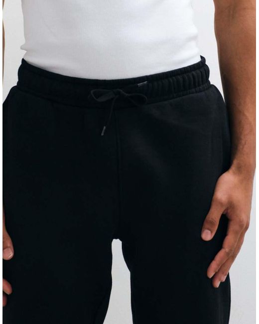 Joggers Negros Básicos De Corte Slim De ASOS de hombre de color Black