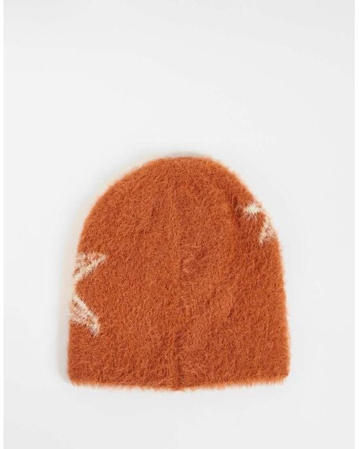 Reclaimed Vintage Orange Unisex Skull Beanie With Star Print