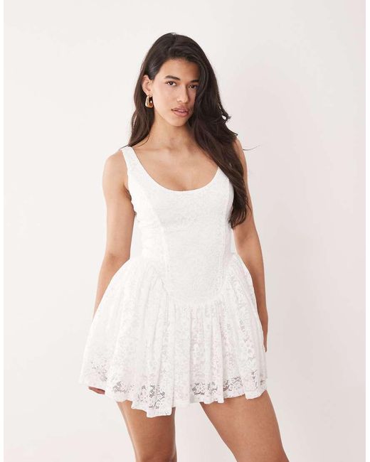Aria Cove White Lace Scoop Neck Corset Detail Frill Hem Mini Dress