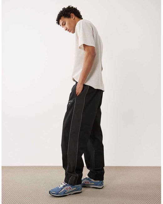 New Balance Black Trackside Woven Pant for men