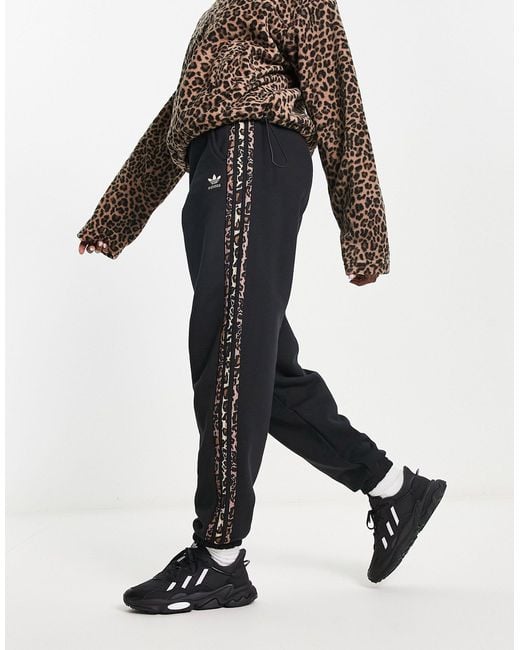 Adidas Originals Black jogger With Leopard Print Three Stripe